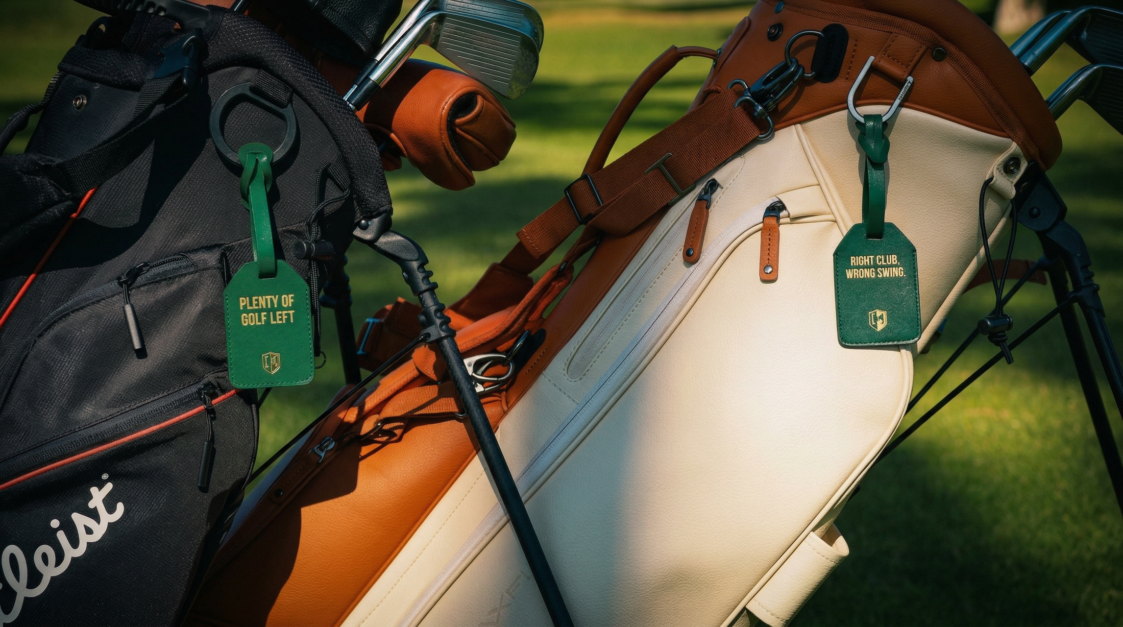 Golf bags with tags on a golf course